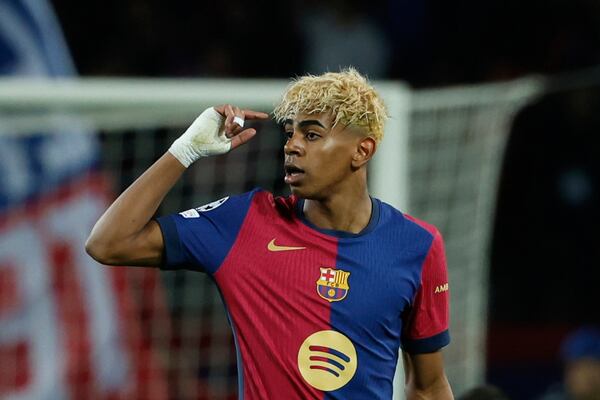 Barcelona's Lamine Yamal celebrates after scoring his side's opening goal during the Champions League semifinal first leg soccer match between Barcelona and Inter Milan at the Lluis Companys Olympic Stadium in Barcelona, Spain, Wednesday, April 30, 2025. (AP Photo/Joan Monfort)
