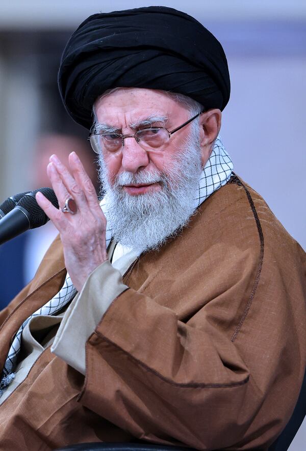 In this photo released by an official website of the office of the Iranian supreme leader, Supreme Leader Ayatollah Ali Khamenei gestures in a meeting with a group of air force officers in Tehran, Iran, Friday, Feb. 7, 2025. (Office of the Iranian Supreme Leader via AP)