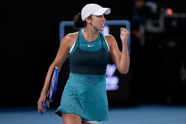 Madison Keys of the U.S. reacts during her semifinal match against Iga Swiatek of Poland at the Australian Open tennis championship in Melbourne, Australia, Thursday, Jan. 23, 2025. (AP Photo/Asanka Brendon Ratnayake)