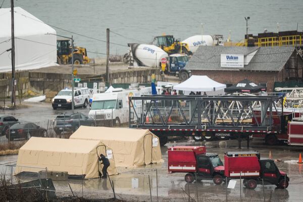 Emergency vehicles and recovery operations are seen near the mouth of the Anacostia River at the Potomac River near Ronald Reagan Washington National Airport, Friday, Jan. 31, 2025, in Washington. (AP Photo/Carolyn Kaster)