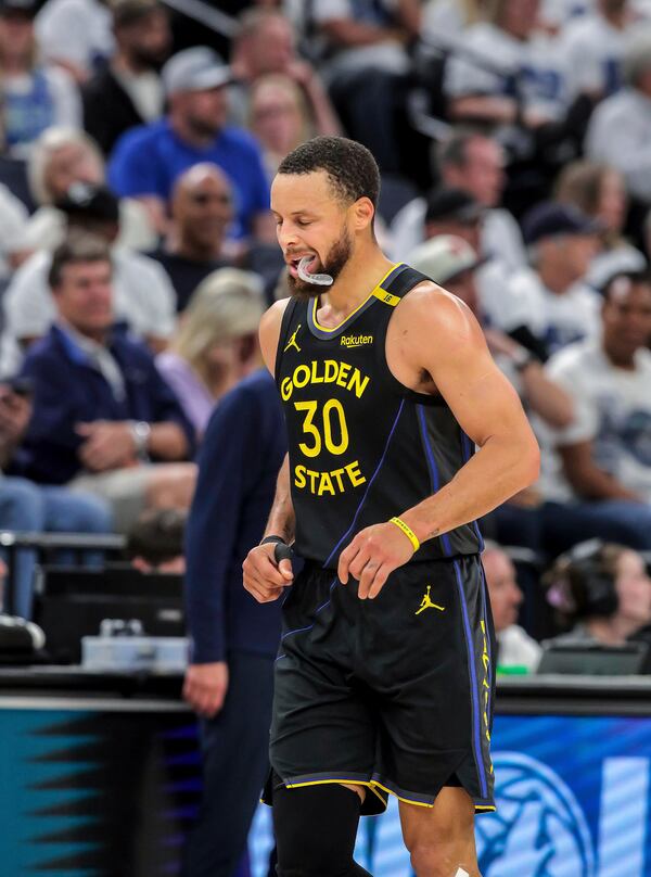 Stephen Curry (30) heads back to the bench in the first half as the Golden State Warriors played the Minnesota Timberwolves in Game 1 of the Second Round of the NBA Playoffs at Target Center in Minneapolis, Minn., on Tuesday, May 6, 2025. ( Carlos Avila Gonzalez/San Francisco Chronicle via AP)