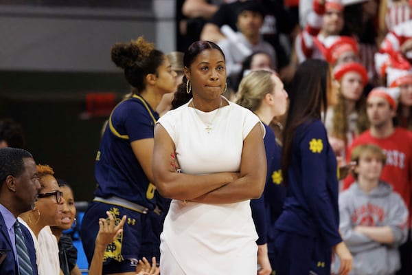 Notre Dame head coach Niele Ivey, center, looks on during the second half of an NCAA college basketball game against North Carolina State in Raleigh, N.C., Sunday, Feb. 23, 2025. (AP Photo/Ben McKeown)