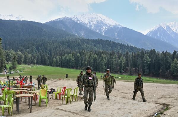 FILE - Indian security officers inspect the site where militants indiscriminately opened fired on tourists on Tuesday, in Pahalgam, Indian controlled Kashmir, Wednesday, April 23, 2025. (AP Photo, File)