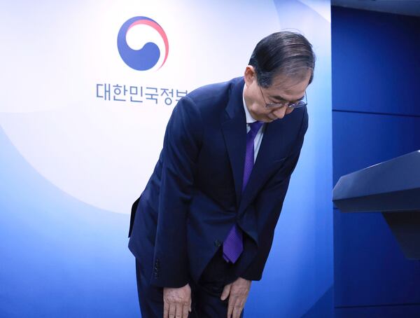 South Korean acting President Han Duck-soo bows after a press conference at the Government Complex in Seoul, South Korea, Thursday, May 1, 2025. (Hong Hae-in/Yonhap via AP)