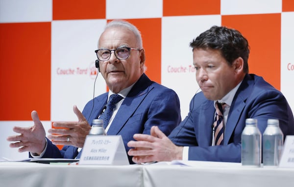 Alain Bouchard, chairman of Canada’s Alimentation Couche-Tard, left, and President and CEO Alex Miller attend a press conference in Tokyo, Japan, Thursday, March 13, 2025. (Kyodo News via AP)