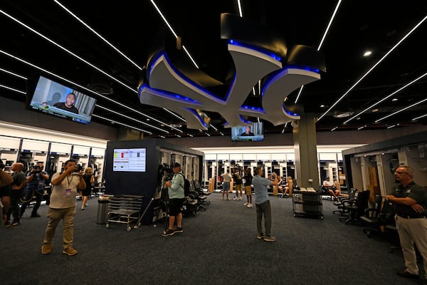 Members of the media look around the New York Yankees clubhouse during a tour of the upgraded team spring training facilities Thursday, Feb. 13, 2025, at George M. Steinbrenner Field in Tampa, Fla. (AP Photo/Steve Nesius)