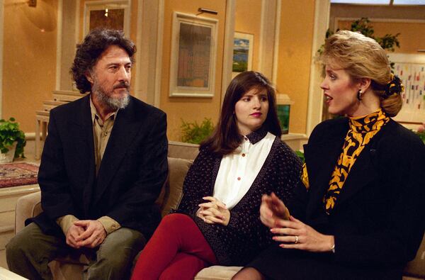 FILE - Actor Dustin Hoffman and Allison Atlas talk with Deborah Norville, at right, while taping a spot on the NBC "Today Show" in New York, February 28, 1990. (AP Photo/Marty Lederhandler, File)