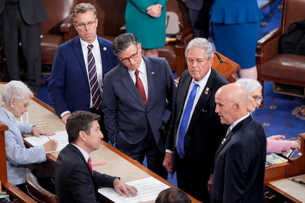 Speaker of the House Mike Johnson, R-La., third right, stands with with conservative Republican members, from left, Rep. Andy Ogles, R-Tenn., Rep. Ralph Norman, R-S.C., and Rep. Keith Self, R-Texas, as the Freedom Caucus members agree to change their vote in favor of Johnson to stay on as speaker, as the House of Representatives convenes the new 119th Congress with a slim Republican majority, at the Capitol in Washington, Friday, Jan. 3, 2025. (AP Photo/J. Scott Applewhite)