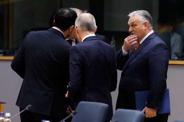 Hungary's Prime Minister Viktor Orban, right, during a round table meeting at an EU Summit in Brussels, Thursday, March 6, 2025. (AP Photo/Geert Vanden Wijngaert)