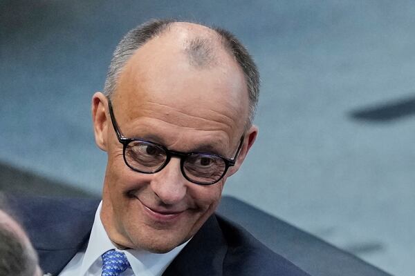 Friedrich Merz waits for the beginning of a session where he is supposed to be elected new Chancellor in the German federal parliament, Bundestag, at the Reichstag building in Berlin, Tuesday, May 6, 2025. (AP Photo/Ebrahim Noroozi)