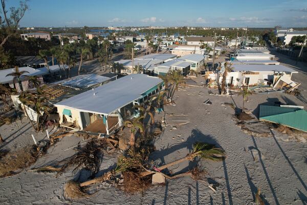 FILE - Damage from Hurricane Milton is seen at a mobile home community on Manasota Key, in Englewood, Fla., Sunday, Oct. 13, 2024. (AP Photo/Rebecca Blackwell, File)