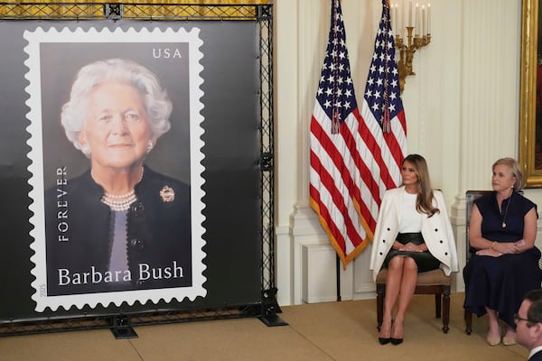 First lady Melania Trump, seated left, and Dorothy Bush Koch look on after unveiling a U.S. Postal Service Stamp honoring former first lady Barbara Bush, Thursday, May 8, 2025, in the East Room of the White House in Washington. (AP Photo/Jacquelyn Martin)