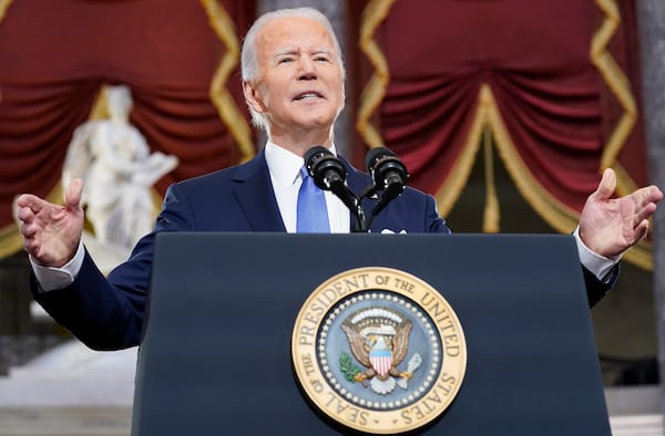 FILE - President Joe Biden speaks from Statuary Hall at the U.S. Capitol to mark the one year anniversary of the Jan. 6 riot at the Capitol by supporters loyal to then-President Donald Trump, Jan. 6, 2022, in Washington. (AP Photo/Andrew Harnik, File)