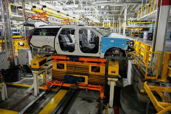 A 2025 Ford Expedition moves on an assembly line during a media tour to launch the 2025 Ford Expedition at the Ford Motor Company Kentucky Truck Plant, Wednesday, April 30, 2025, in Louisville, Ky. (AP Photo/Carolyn Kaster)