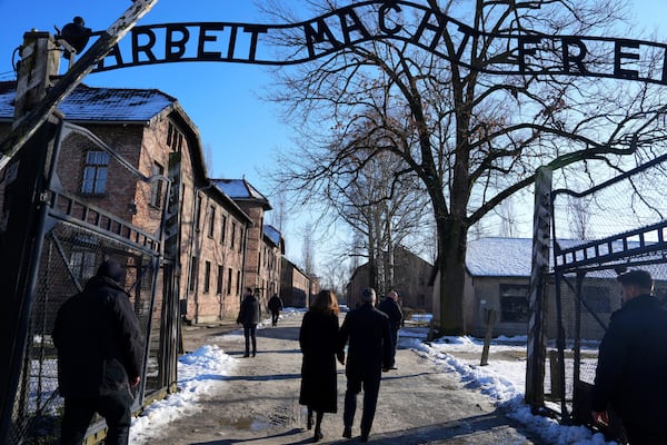 Britain's Prime Minister Keir Starmer and his wife Victoria Starmer visit the Memorial And Museum Auschwitz-Birkenau, a former Nazi German concentration and extermination camp, in Oswiecim, Poland, Friday Jan. 17, 2025. (Aleksandra Szmigiel/Pool via AP)