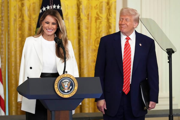 President Donald Trump, right, watches as first lady Melania Trump speaks at an event for Military Mothers, Thursday, May 8, 2025, in the East Room of the White House in Washington. (AP Photo/Jacquelyn Martin)