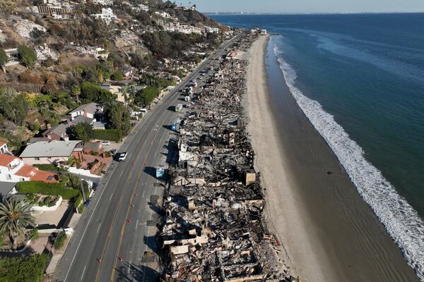 An aerial view shows the devastation from the Palisades Fire on beachfront homes Wednesday, Jan. 15, 2025 in Malibu, Calif. (AP Photo/Jae C. Hong)