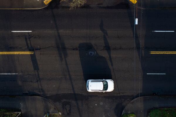 A car drives past along César E. Chávez Boulevard, Monday, March 17, 2025, in Portland, Ore. (AP Photo/Jenny Kane)