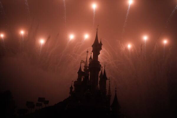 A firework display lights up the castle of Sleeping Beauty in Disneyland, in Marne-la-Vallee, east of Paris, Friday Jan. 17, 2025. (AP Photo/Thibault Camus)