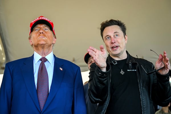 FILE - President-elect Donald Trump listens to Elon Musk as he arrives to watch SpaceX's mega rocket Starship lift off for a test flight from Starbase in Boca Chica, Texas, Nov. 19, 2024. (Brandon Bell/Pool via AP, File)