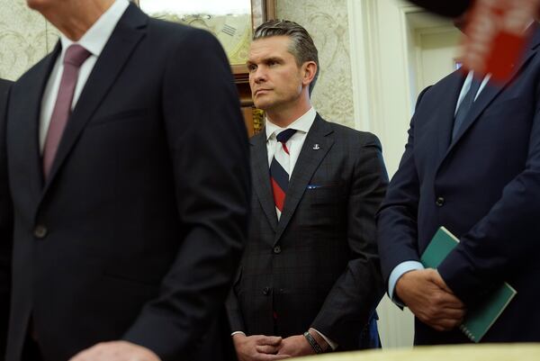 Defense Secretary Pete Hegseth listens as President Donald Trump meets with Israel's Prime Minister Benjamin Netanyahu in the Oval Office of the White House, Tuesday, Feb. 4, 2025, in Washington. (AP Photo/Evan Vucci)