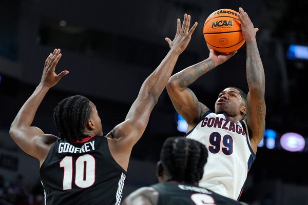 Gonzaga guard Khalif Battle (99) shoots over Georgia forward RJ Godfrey (10) during the second half of the first round of the NCAA college basketball tournament, Thursday, March 20, 2025, in Wichita, Kan. (AP Photo/Charlie Riedel)