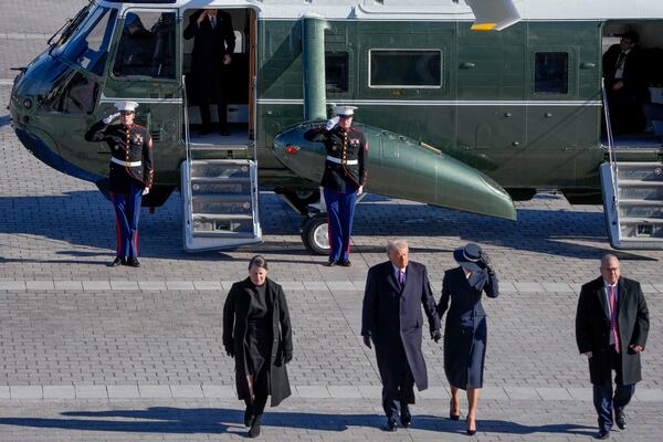 First lady Melania Trump, from second right, and President Donald Trump walk walk as former President Joe Biden salutes after boarding a Marine helicopter en route to Joint Base Andrews after the 60th Presidential Inauguration, Monday, Jan. 20, 2025, at the U.S. Capitol in Washington. (Jack Gruber/Pool Photo via AP)