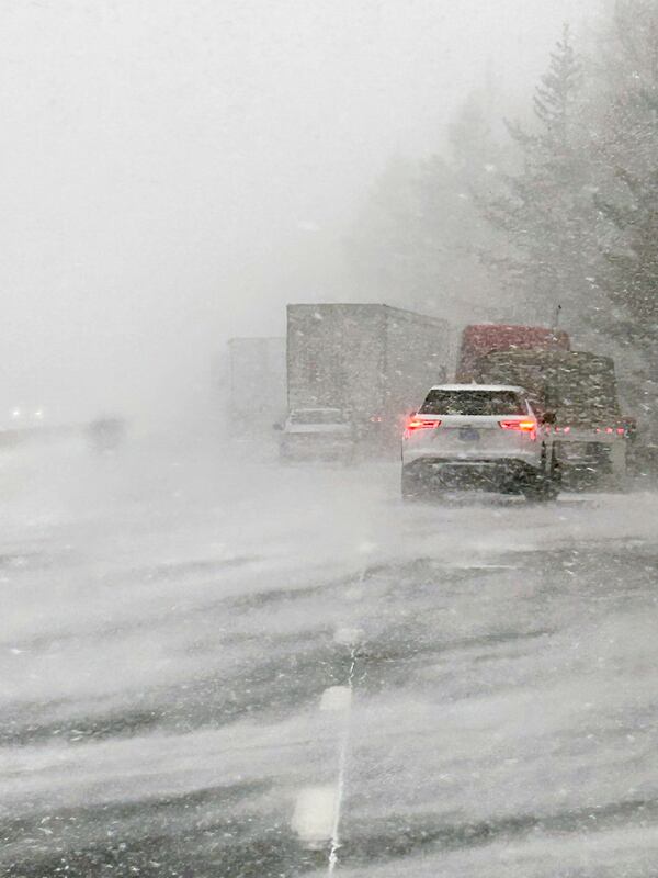 In this image provided by the Multnomah County Sheriff's Office, officials respond to a more than 100-vehicle pileup in whiteout conditions on westbound Interstate 84 on Thursday, Feb. 13, 2025, near Multnomah Falls, Ore. (Multnomah County Sheriff's Office via AP)