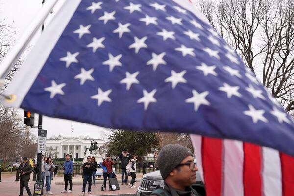 Doris Coulter of Columbus, Ohio, protests against the Trump administration near the White House Friday, March 14, 2025, in Washington. (AP Photo/Jacquelyn Martin)