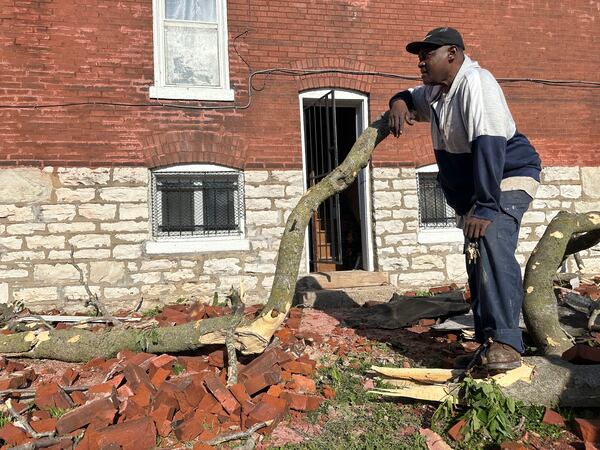 Greg Simmons, 55, a St. Louis resident, surveyed damage after a storm ripped the roof off of his home on Friday, May 16, 2025. (AP Photo/Michael Phillis)