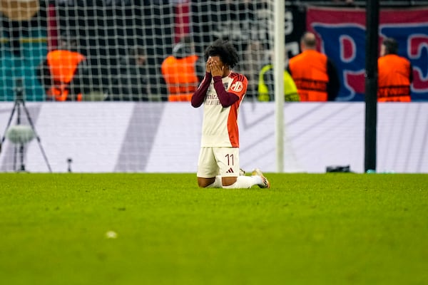 Lyon's Malick Fofana prays at the end of the Europa League round of 16, first leg soccer match between FCSB and Lyon at the National Arena stadium, Thursday, March 6, 2025. (AP Photo/Andreea Alexandru)