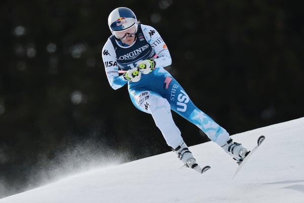 United States' Lindsey Vonn competes in a downhill run of a women's team combined event, at the Alpine Ski World Championships, in Saalbach-Hinterglemm, Austria, Tuesday, Feb. 11, 2025. (AP Photo/Marco Trovati)