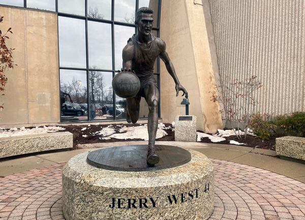 A statue honoring NBA great Jerry West, stands outside the West Virginia University Coliseum, in Morgantown, W.Va., Saturday, Jan. 18, 2025, as fans arrive for an NCAA college basketball game between Iowa State and West Virginia. (AP Photo/John Raby)