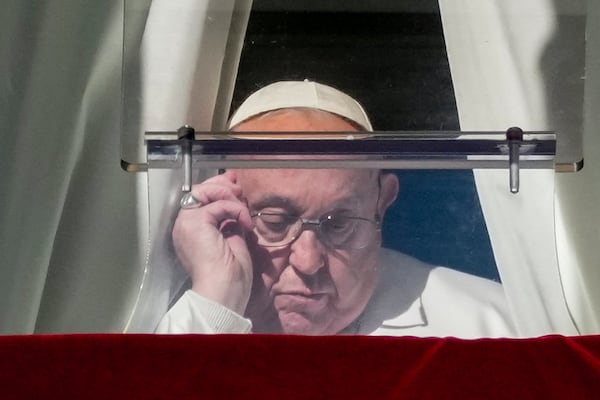 Pope Francis arrives to recite the Angelus noon prayer from the window of his studio overlooking St. Peter's Square, at the Vatican, Thursday, Dec. 26, 2024. (AP Photo/Andrew Medichini)