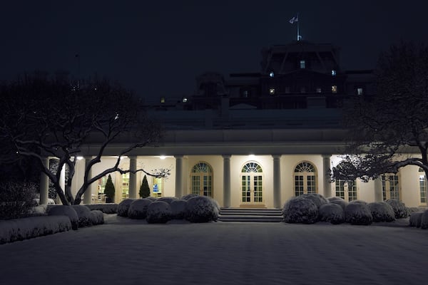 Snow falls as seen from the Rose Garden at the White House, Tuesday, Feb. 11, 2025, in Washington. (AP Photo/Evan Vucci)