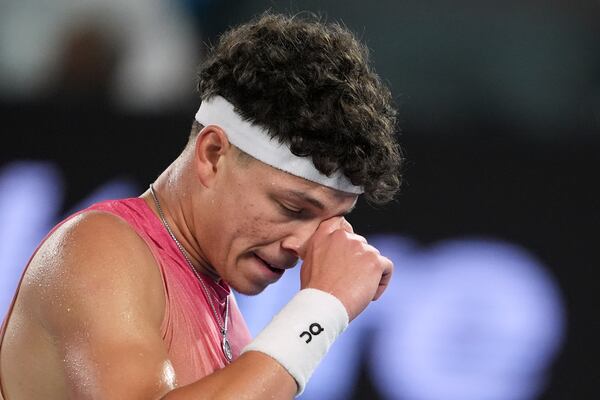 Ben Shelton of the U.S. reacts during his semifinal match against Jannik Sinner of Italy at the Australian Open tennis championship in Melbourne, Australia, Friday, Jan. 24, 2025. (AP Photo/Ng Han Guan)