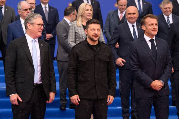 Britain's Prime Minister Keir Starmer, left, Ukraine's President Volodymyr Zelenskyy and France's President Emmanuel Macron, right, during a group photo at the beginning of a summit where the leaders of 47 European countries and organizations will discuss security, defense and democratic standards, in Tirana, Albania, Friday, May 16, 2025. (Leon Neal/Pool via AP)