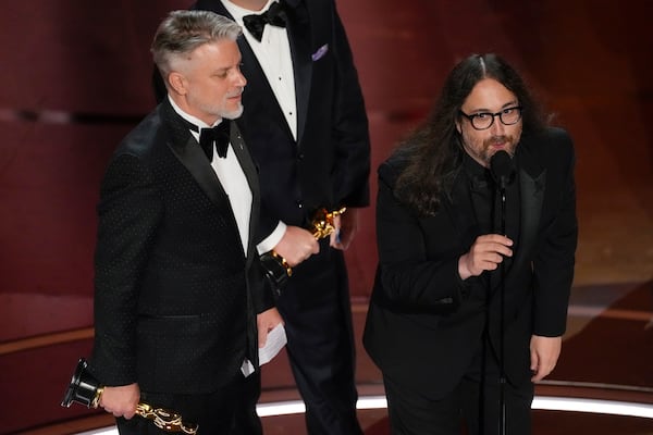 FILE - Dave Mullins, left, and Sean Ono Lennon accept the award for best animated short for "War Is Over! Inspired by the Music of John & Yoko" during the Oscars on March 10, 2024, in Los Angeles. (AP Photo/Chris Pizzello, File)