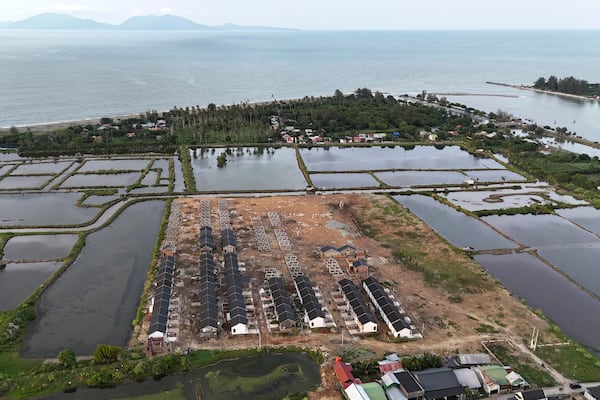 A housing complex is seen under construction near the waterfront area in Banda Aceh, Indonesia, Thursday, Dec. 12, 2024. (AP Photo/Achmad Ibrahim)