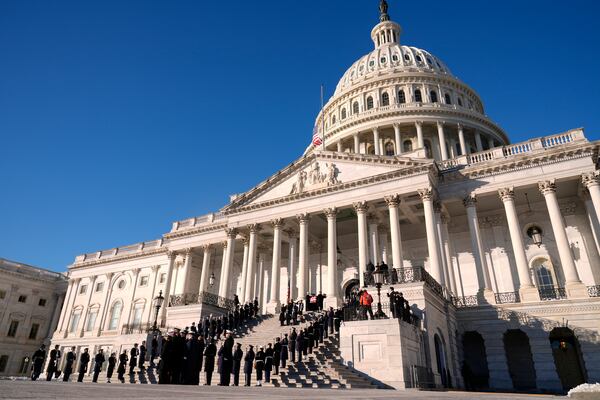 A joint services body bearer team carries the flag-draped casket of former President Jimmy Carter from the U.S. Capitol in Washington, Thursday, Jan. 9, 2025, to head to Washington National Cathedral for a State Funeral. (AP Photo/Susan Walsh, Pool)