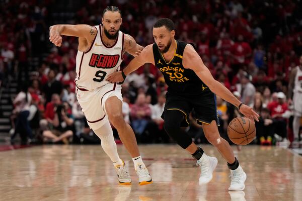 Houston Rockets' Dillon Brooks (9) defends against Golden State Warriors' Stephen Curry (30) during the second half of Game 7 of an NBA basketball first-round playoff series Sunday, May 4, 2025, in Houston. (AP Photo/Ashley Landis)