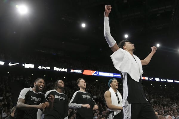 San Antonio Spurs center Victor Wembanyama, right, and teammates celebrate during the second half of a Paris Games 2025 NBA basketball game against the Indiana Pacers in Paris, Thursday, Jan. 23, 2025. (AP Photo/Thibault Camus)