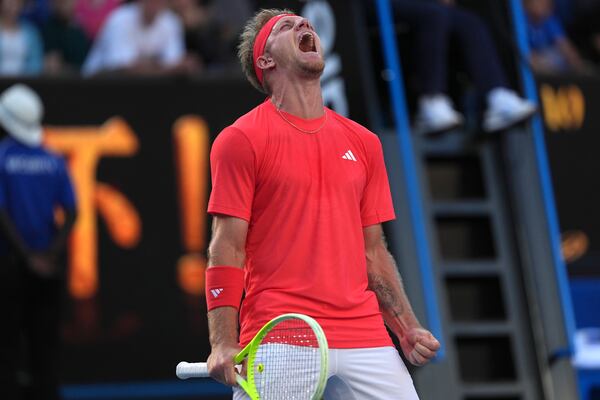 Alejandro Davidovich Fokina of Spain celebrates aftre defeating Jakub Mensik of the Czech Republic in their third round match at the Australian Open tennis championship in Melbourne, Australia, Friday, Jan. 17, 2025. (AP Photo/Ng Han Guan)