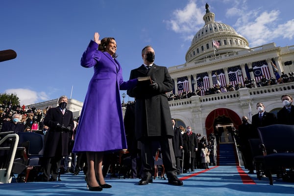 FILE - Kamala Harris is sworn in as Vice President by Supreme Court Justice Sonia Sotomayor as her husband Doug Emhoff holds the Bible during the 59th Presidential Inauguration at the U.S. Capitol in Washington, Jan. 20, 2021. (AP Photo/Andrew Harnik, Pool, File)