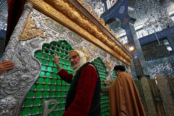 Shiite worshippers pray at the Sayyida Zeinab shrine where many Shiite Muslims believe Zeinab, the granddaughter of Prophet Muhammad is entombed, in Sayyida Zeinab, south of Damascus, Syria, Saturday March 15, 2025.(AP Photo/Omar Sanadiki)