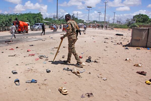 Security officer patrol near the scene of a suicide bomber attack in Mogadishu, Somalia Sunday, May 18, 2025. (AP Photo/Farah Abdi Warsameh)