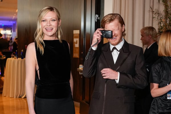 Kirsten Dunst, left, and Jesse Plemons arrive at the 82nd Golden Globes on Sunday, Jan. 5, 2025, at the Beverly Hilton in Beverly Hills, Calif. (AP Photo/Chris Pizzello)