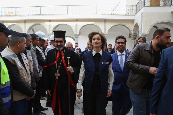 UNESCO Director-General Audrey Azoulay, right, arrives to visit Syriac Catholic al-Tahira Church as she checks historic sites in Mosul, Iraq, Wednesday, Feb. 5, 2025, reconstructed by UNESCO after being damaged in battles with the Islamic State group when it held the city. (AP Photo/Farid Abdulwahed)