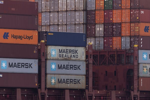 A ship is loaded with containers in the Port of Los Angeles, Monday, March 10, 2025, in San Pedro, Calif. (AP Photo/Etienne Laurent)