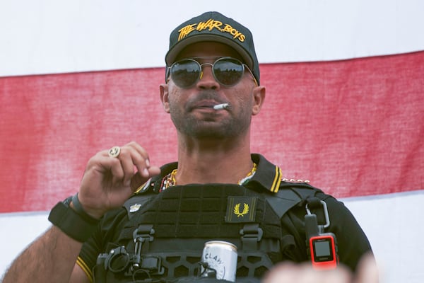 FILE - Proud Boys leader Henry "Enrique" Tarrio wears a hat that says The War Boys during a rally in Portland, Ore., on Sept. 26, 2020. (AP Photo/Allison Dinner, File)